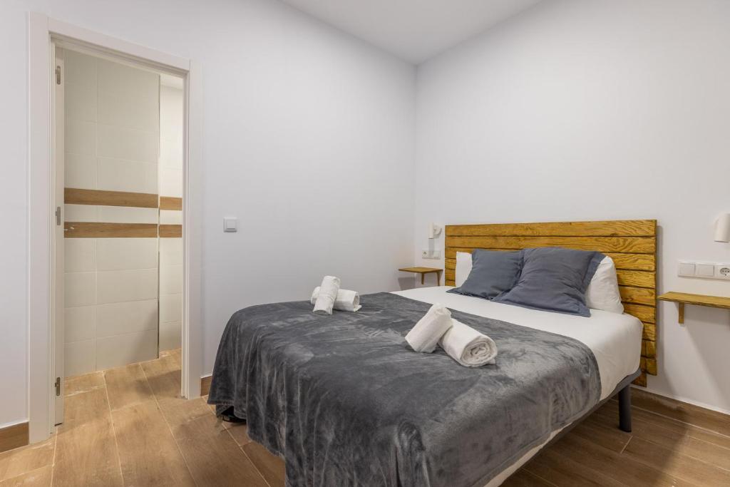 Posteľ alebo postele v izbe v ubytovaní FUN BUILDING STUDIOS by HOMEABOUT