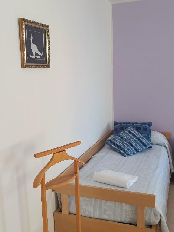 Postel nebo postele na pokoji v ubytování Casa sul Cielo di Burano