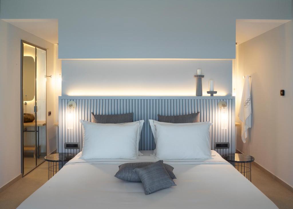 Кровать или кровати в номере Cayo Exclusive Resort & Spa