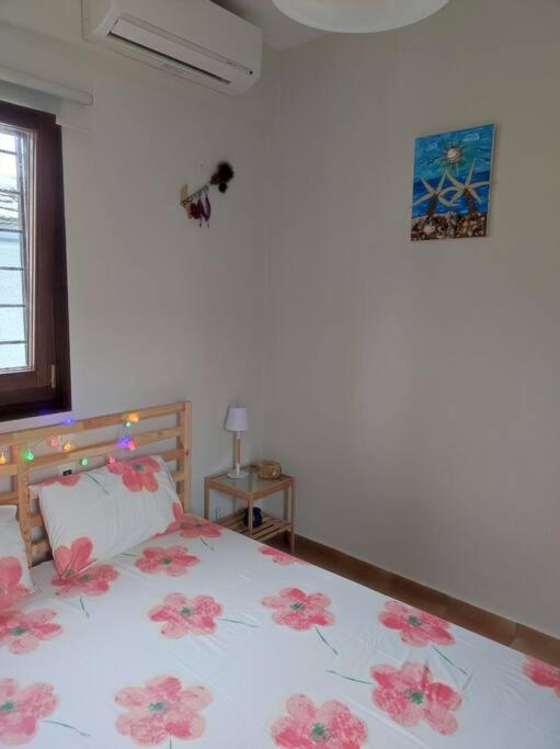 Łóżko lub łóżka w pokoju w obiekcie Marilia Home