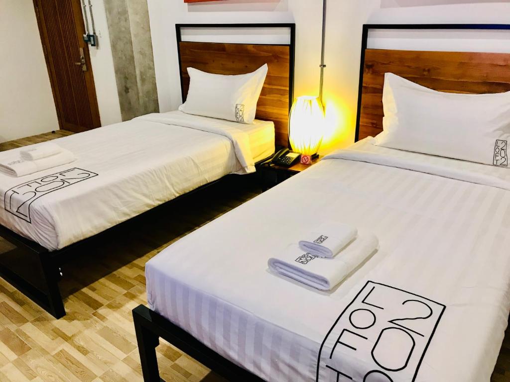 Postel nebo postele na pokoji v ubytování Loft 202 Hotel