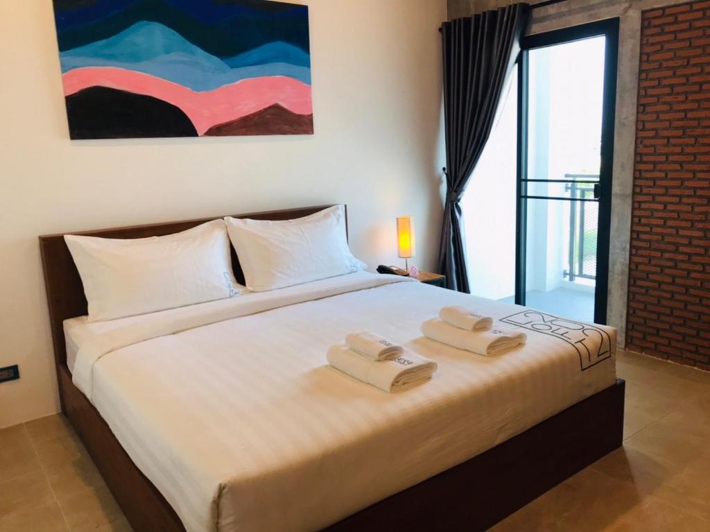 Postel nebo postele na pokoji v ubytování Loft 202 Hotel