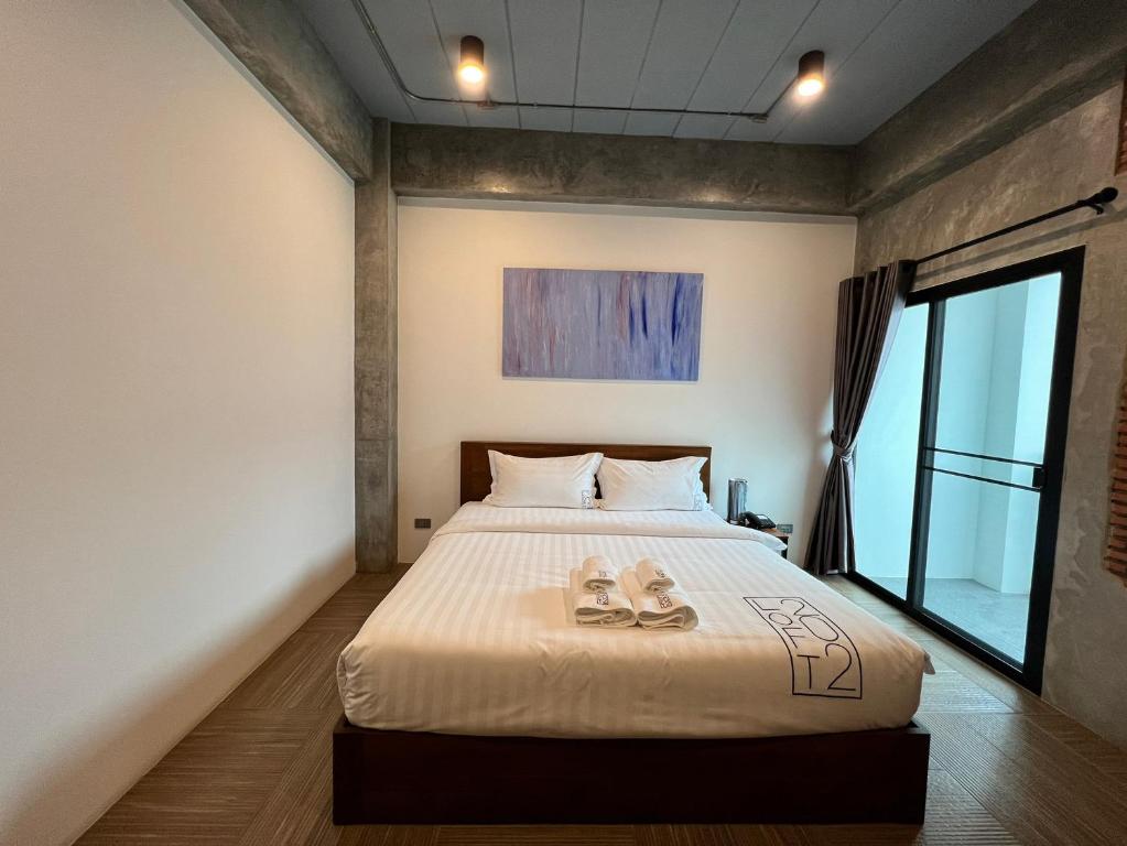 Postel nebo postele na pokoji v ubytování Loft 202 Hotel