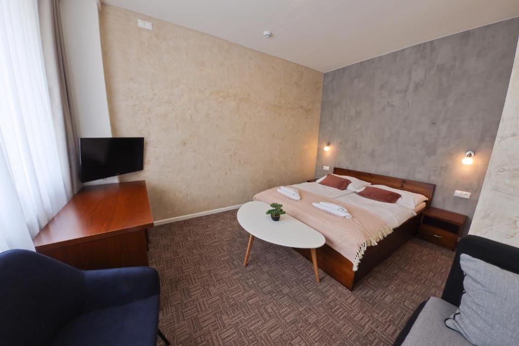 Postel nebo postele na pokoji v ubytování Hotel Slanica