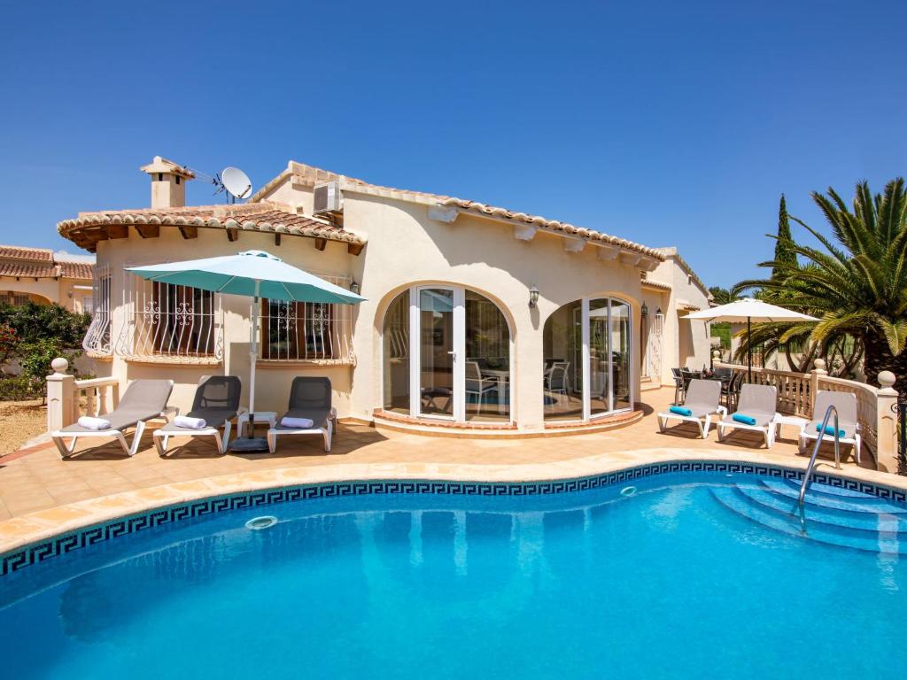 a villa with a swimming pool and a house at Holiday Home La Cala by Interhome in Balcon del Mar