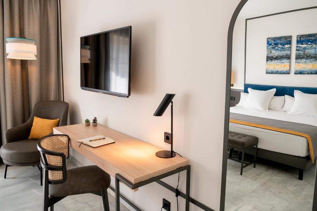 Postel nebo postele na pokoji v ubytování URH Sitges Playa