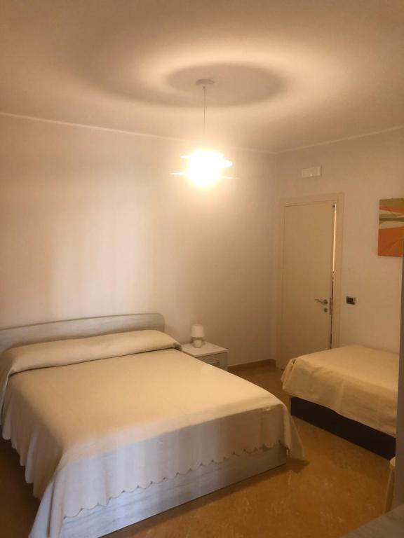 Postel nebo postele na pokoji v ubytování B&B Il Sogno