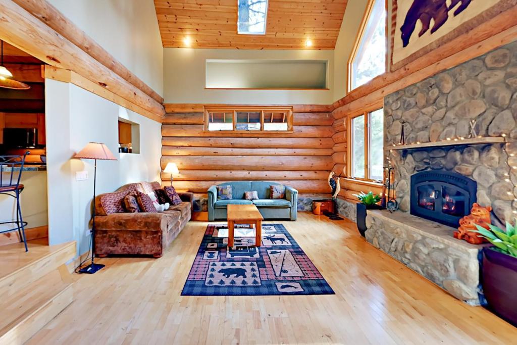 a living room with a couch and a fireplace at Marshall Haven in South Lake Tahoe