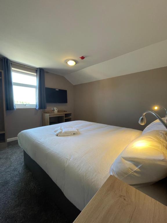 Postel nebo postele na pokoji v ubytování Tinapa Suites