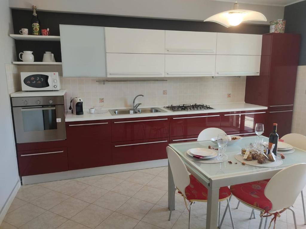 Kuchyň nebo kuchyňský kout v ubytování Casa Vacanza - Sole e Azzurro -