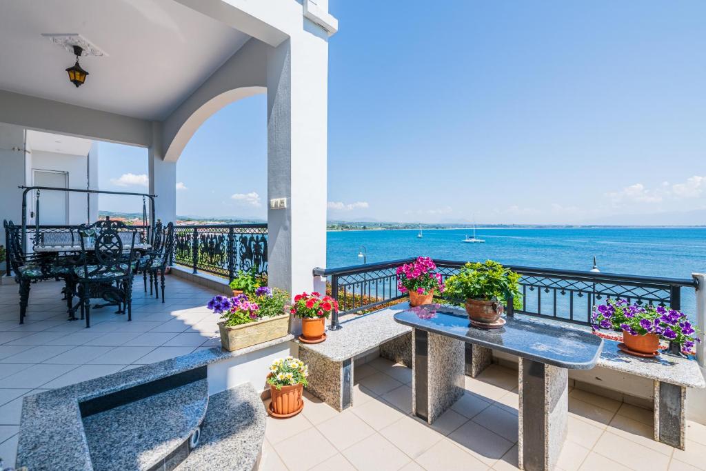 a patio with a view of the ocean at Bay View House in Petalidi