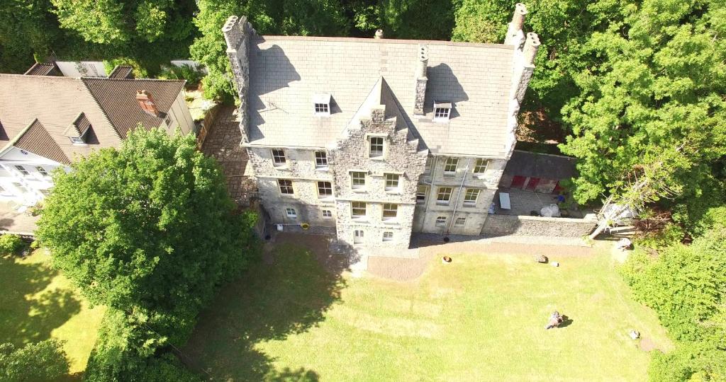 an aerial view of a large house with a yard at Glyn Y Coed, Mumbles in Newton