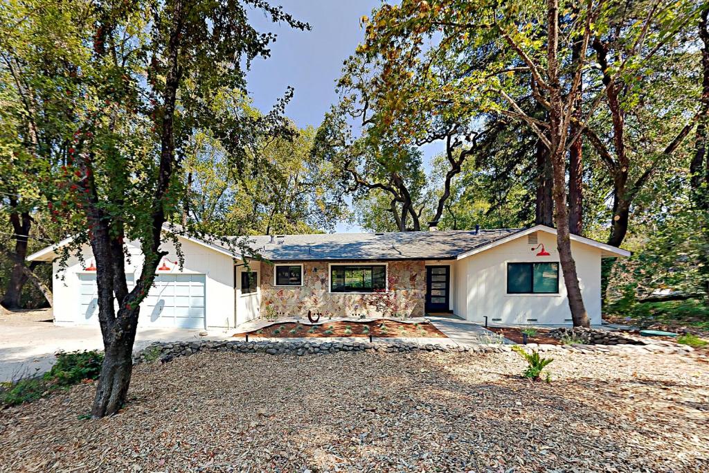 a white house with trees in front of it at The Enso Sonoma in Glen Ellen