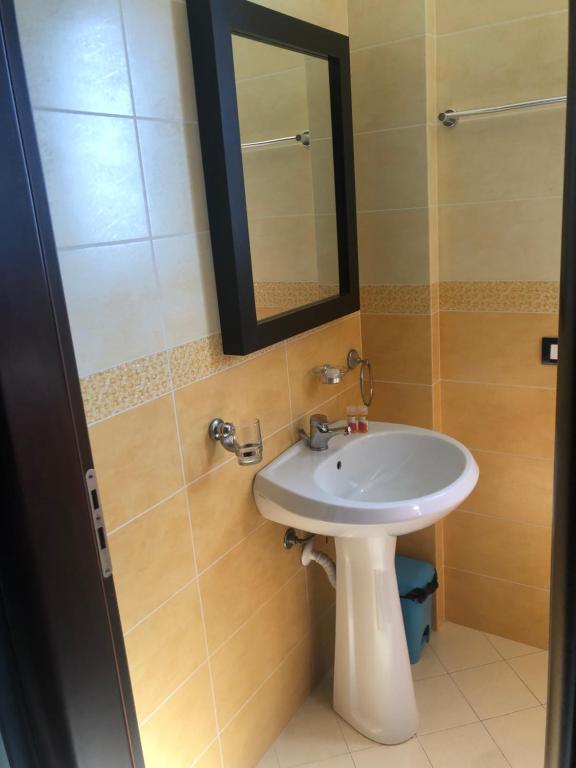 Koupelna v ubytování AL Hotel