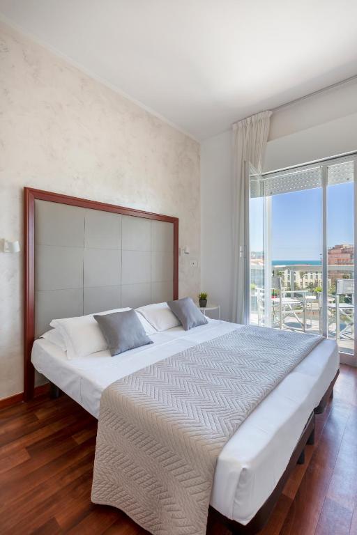 Postel nebo postele na pokoji v ubytování Hotel Imperiale
