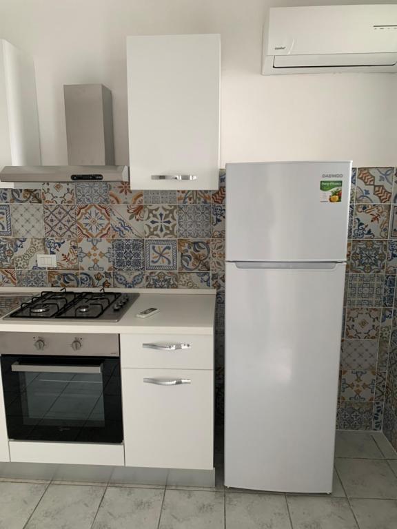 Kuchyň nebo kuchyňský kout v ubytování Residence R&B Tyrrhenum