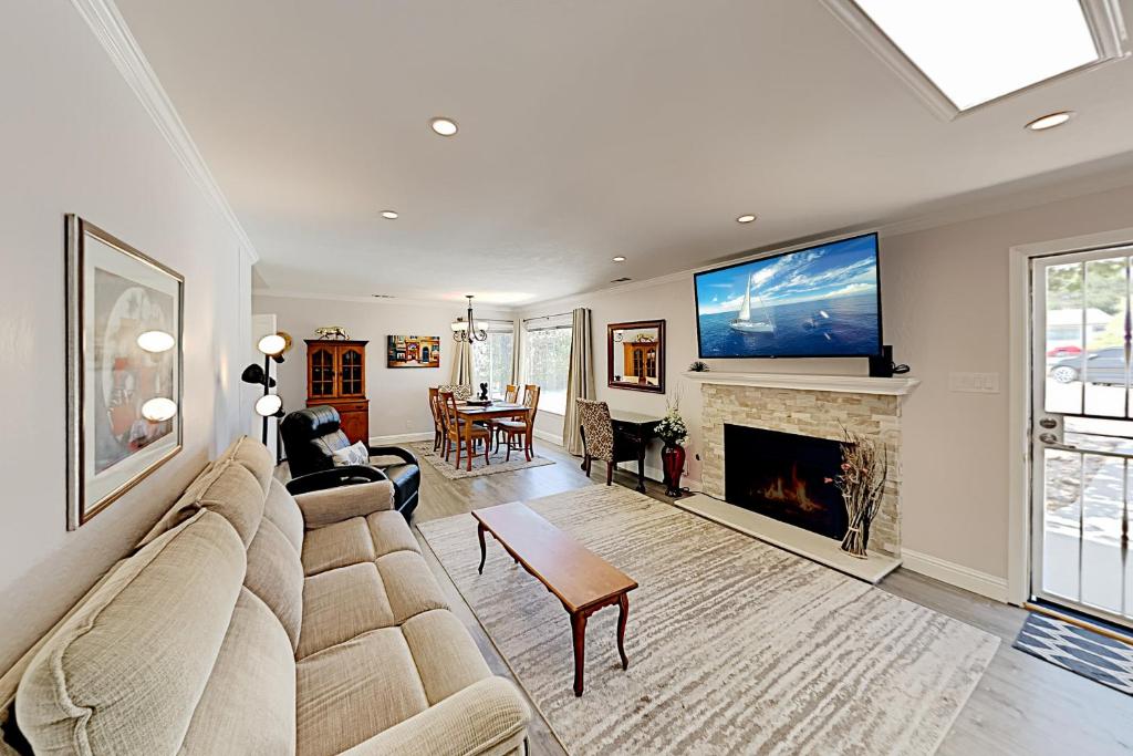 a living room with a couch and a fireplace at Portola Oasis in Monterey
