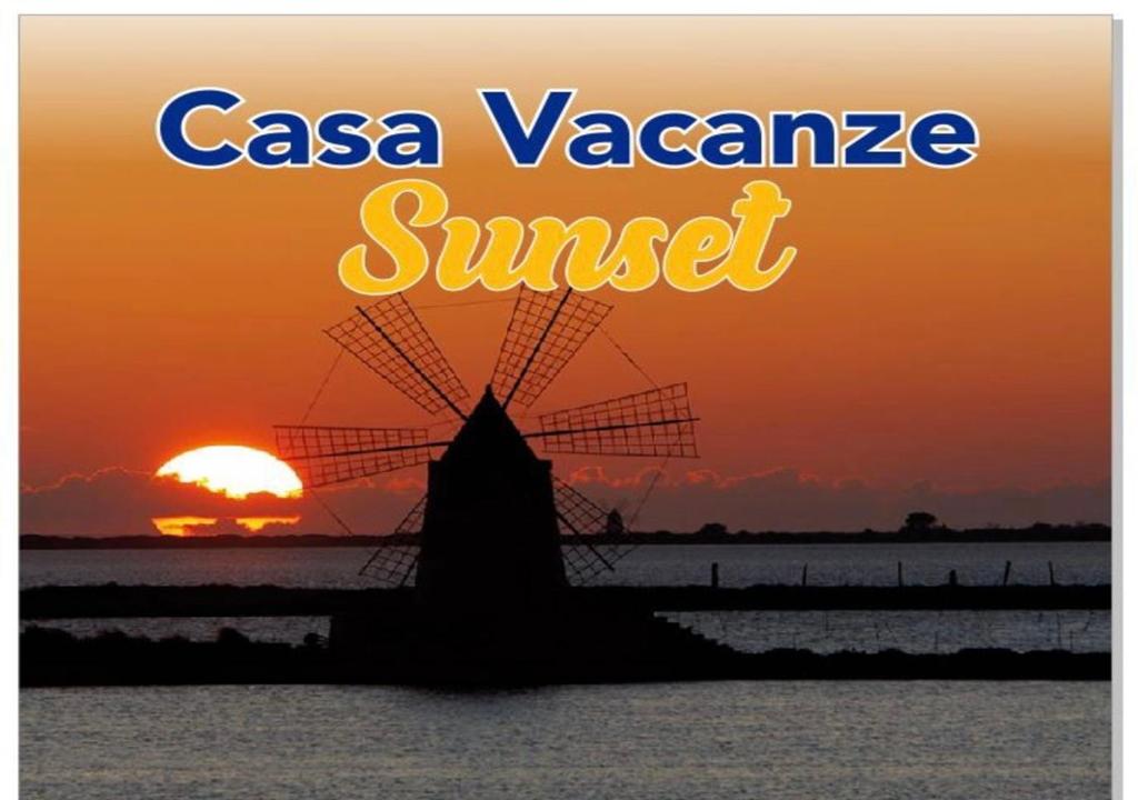 a sunset with the words casa vazquez sunset at Sunset in Trapani