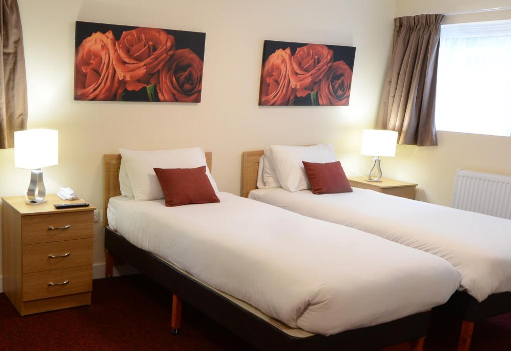 מיטה או מיטות בחדר ב-Grand Hotel Gosforth Park
