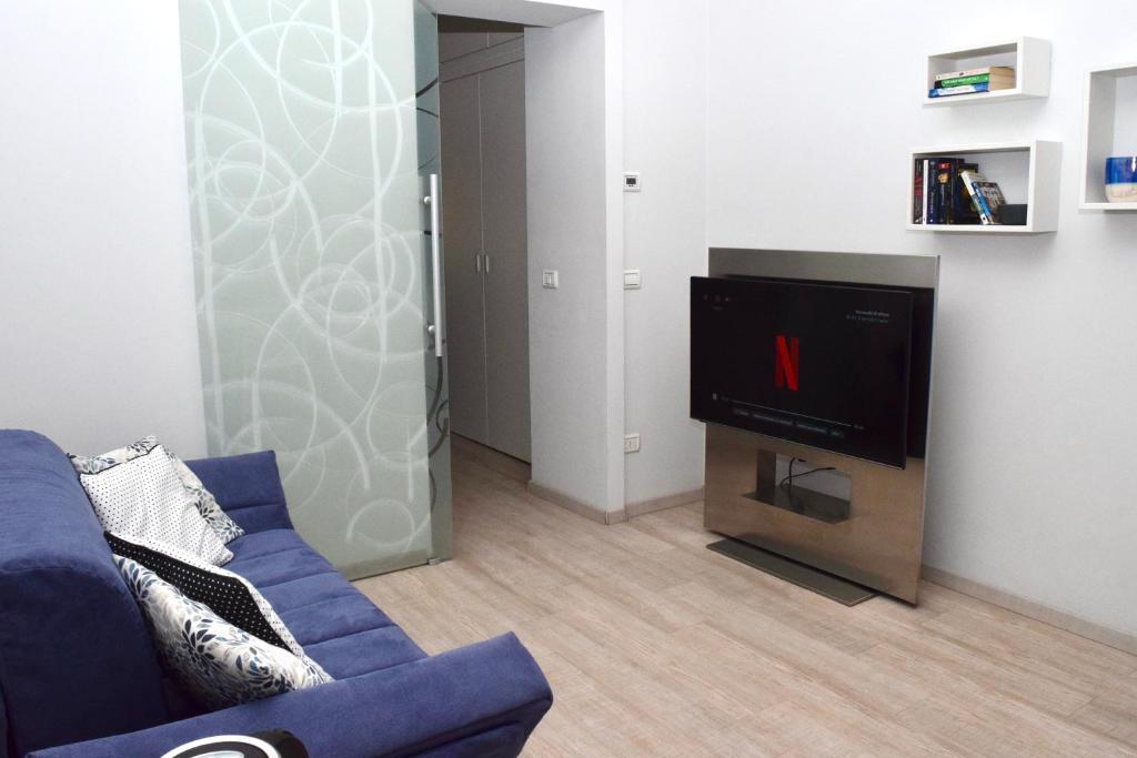 A television and/or entertainment centre at NEW! TUTTO QUI - APT WAGNER - CITY LIFE (cir01686)