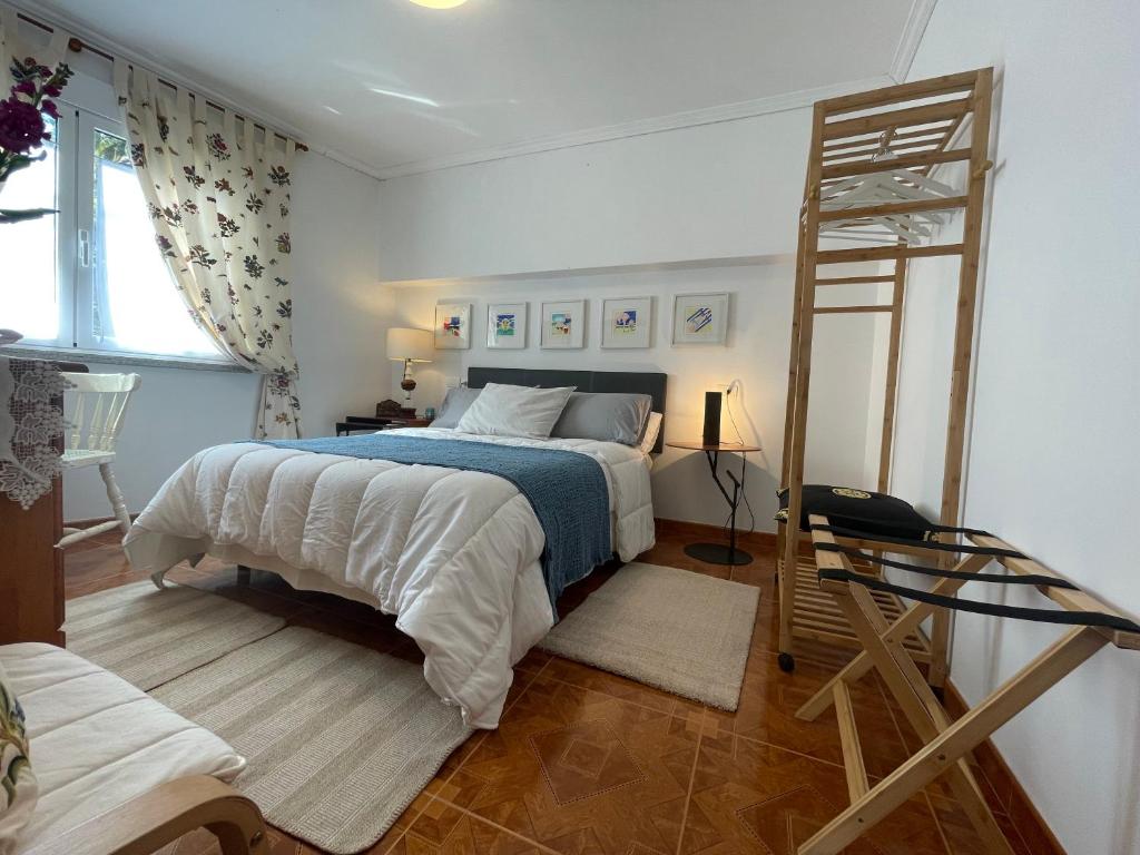a bedroom with a bed and a ladder in it at Fairview in Sabardes