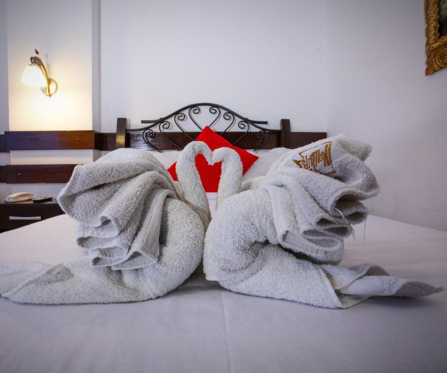 Postel nebo postele na pokoji v ubytování Hotel Kapac Inn-San Blas