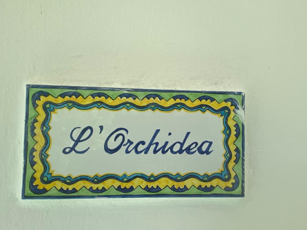 Um certificado, prêmio, placa ou outro documento exibido em Villa Striano Boutique