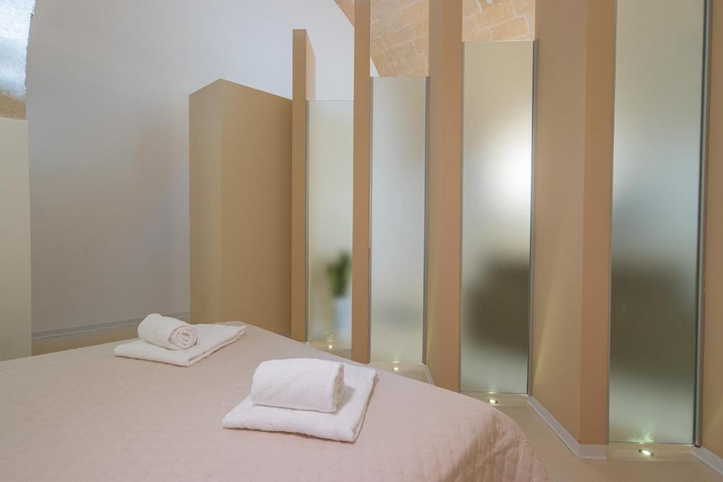 Postel nebo postele na pokoji v ubytování I Lamioni - Suite & accommodation