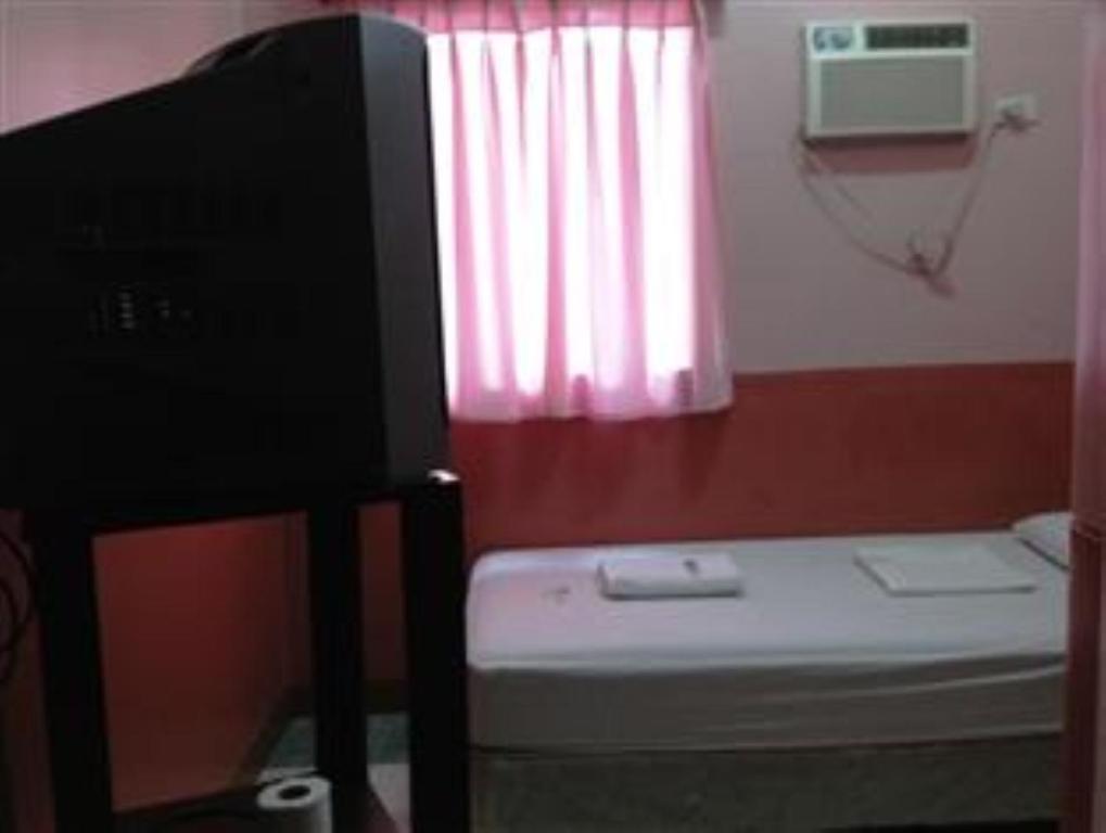 Postel nebo postele na pokoji v ubytování GV Hotel - Camiguin