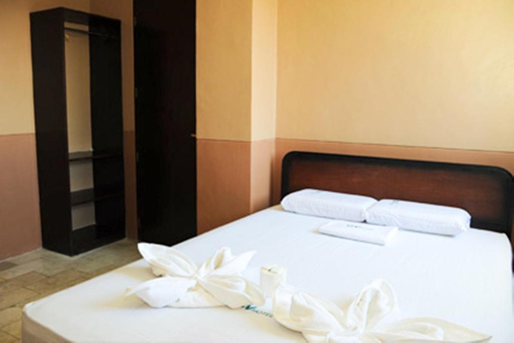 Postel nebo postele na pokoji v ubytování GV Hotel - Camiguin