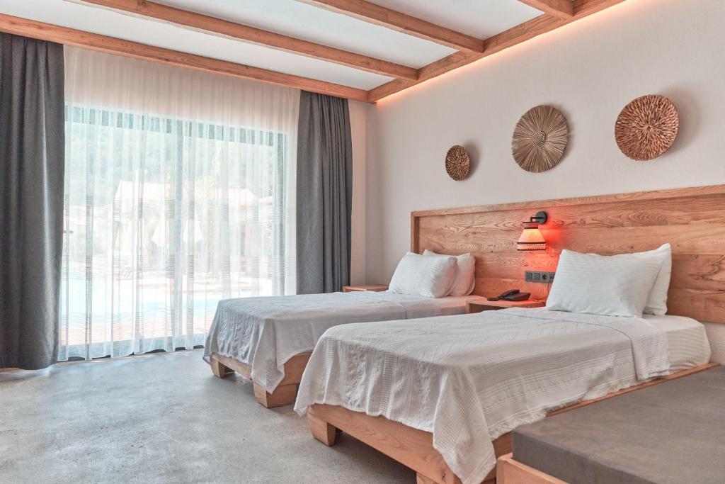 Postel nebo postele na pokoji v ubytování The Pearl Ölüdeniz