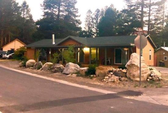 a house with alot of rocks in front of it at Rr-kenton Hs in June Lake