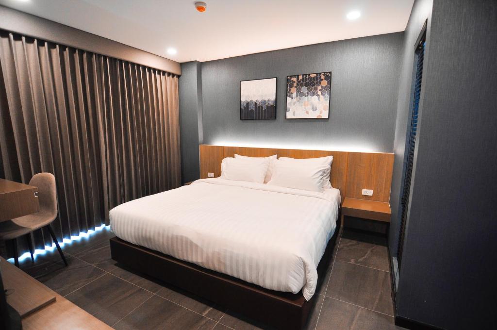 Postel nebo postele na pokoji v ubytování The S Block Condotel
