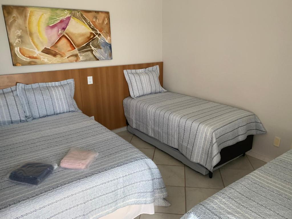 Cama ou camas em um quarto em Suíte 1015 - Thermas Place com Parque Aquático