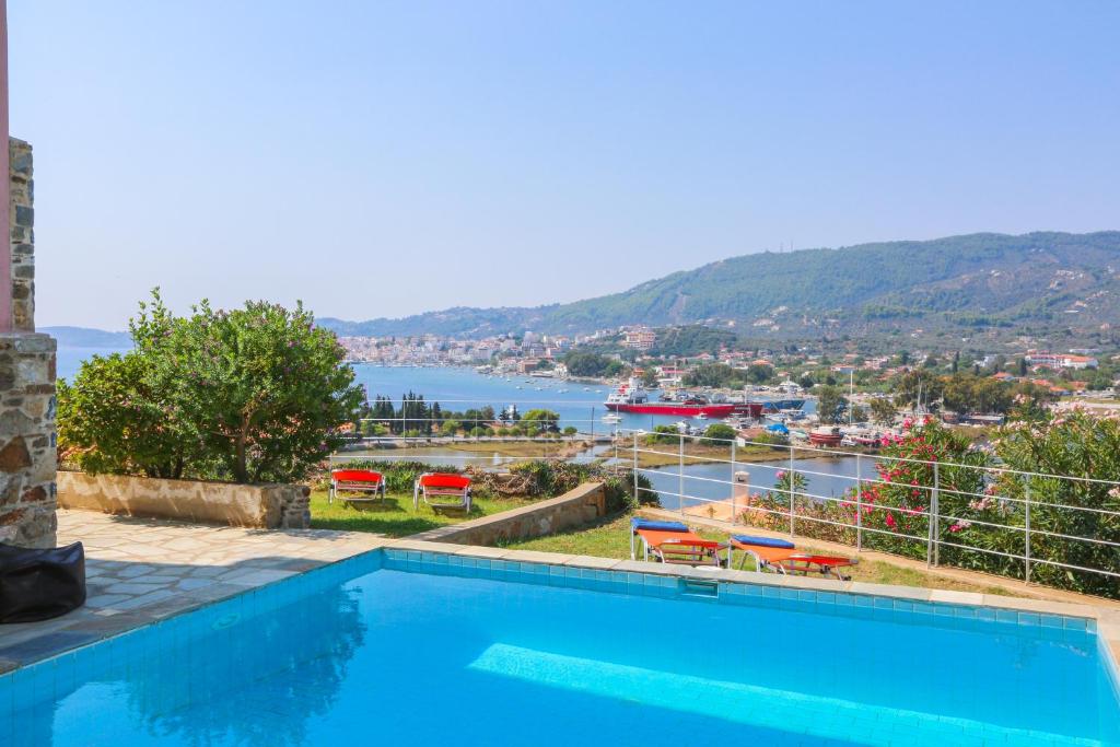 a swimming pool with a view of the water at Skiathos Seaview Villa with Pool in Punta