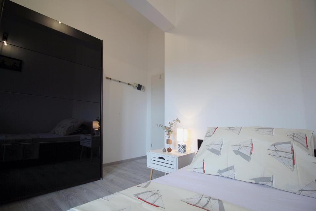 Posteľ alebo postele v izbe v ubytovaní Apartman Cicibella
