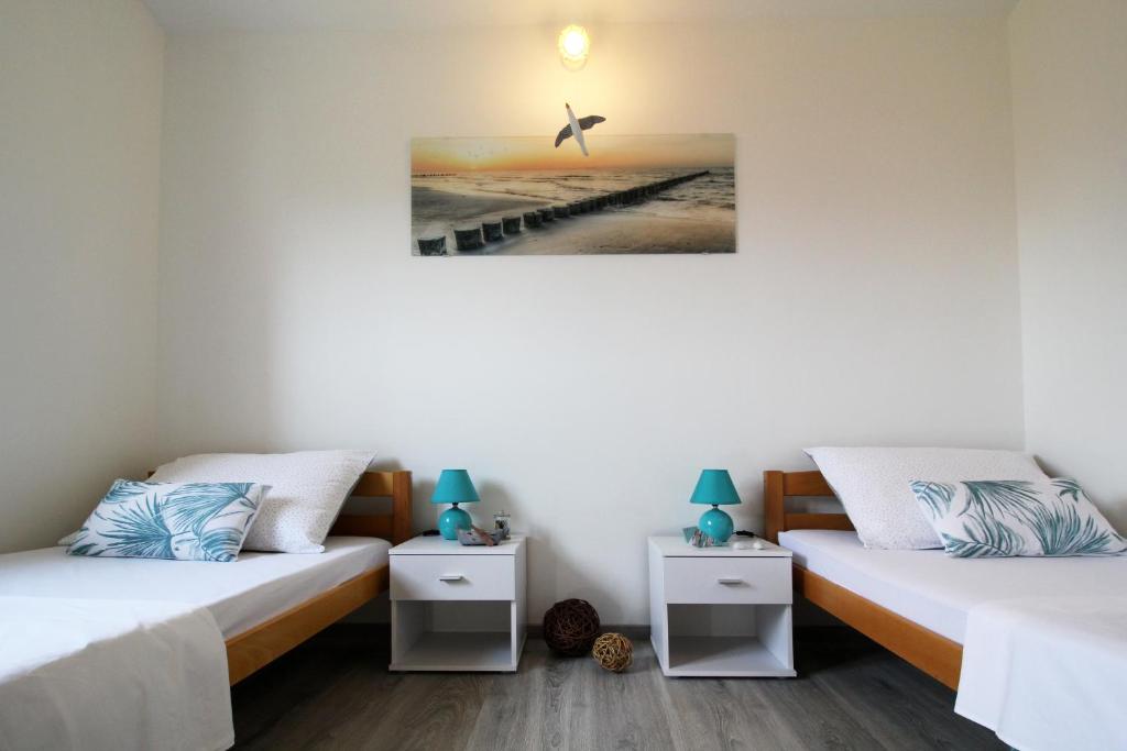 Posteľ alebo postele v izbe v ubytovaní Apartman Cicibella
