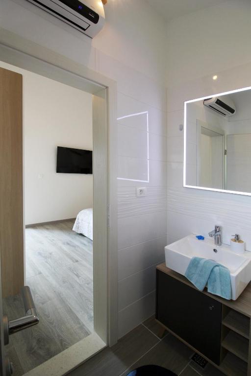 Posteľ alebo postele v izbe v ubytovaní Apartman Cicibella