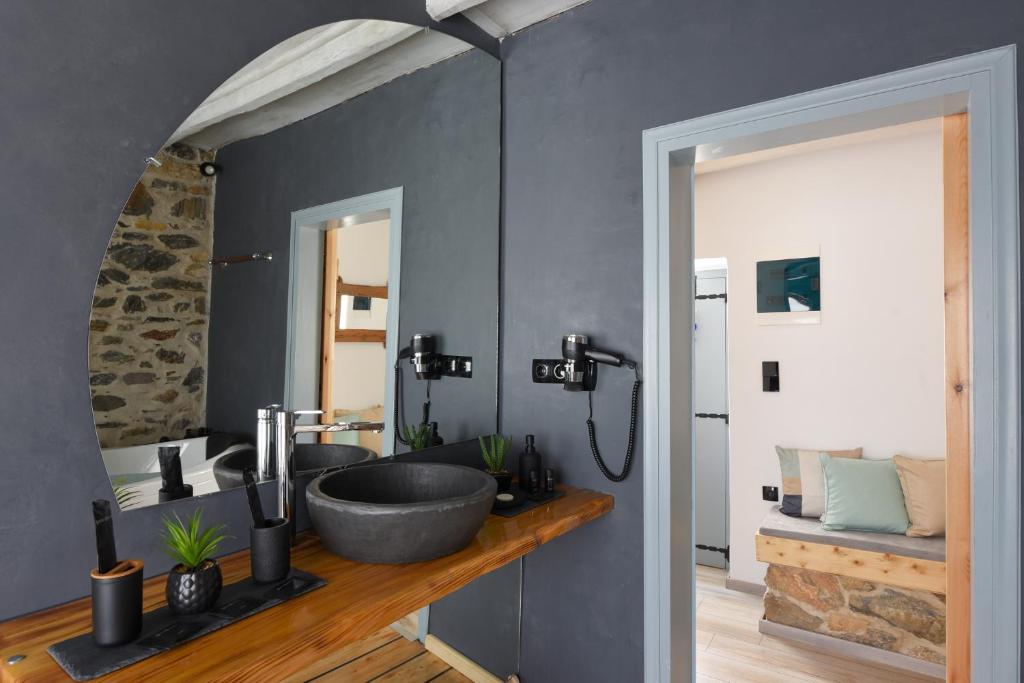 a bathroom with two sinks in a room at Tramuntana in Ano Syros