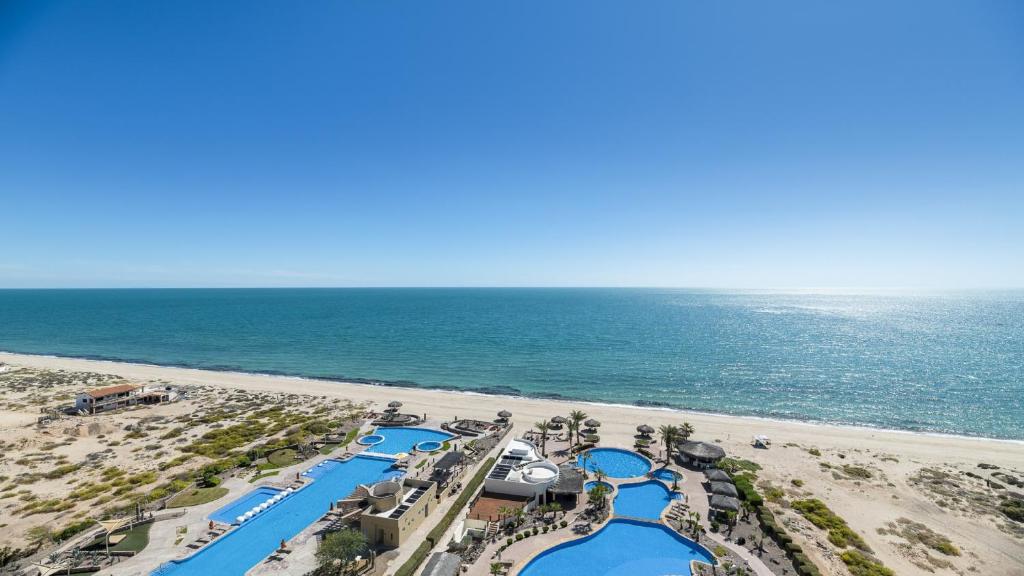 an aerial view of the beach at a resort at Luna Blanca Penthouse by Kivoya in Puerto Peñasco