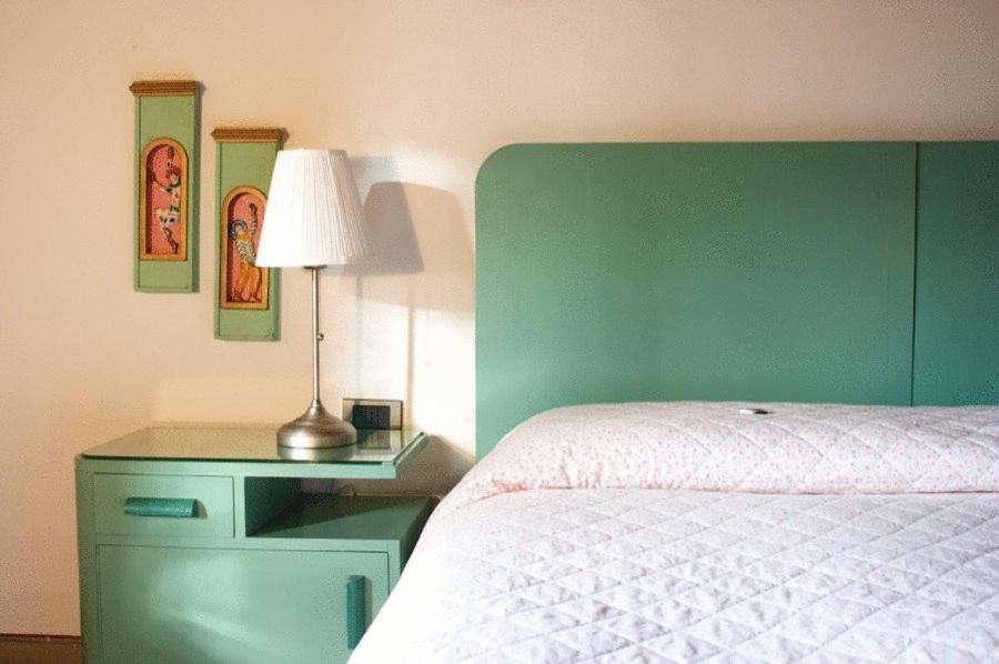 A bed or beds in a room at La Casa Di Adelina Monticchiello