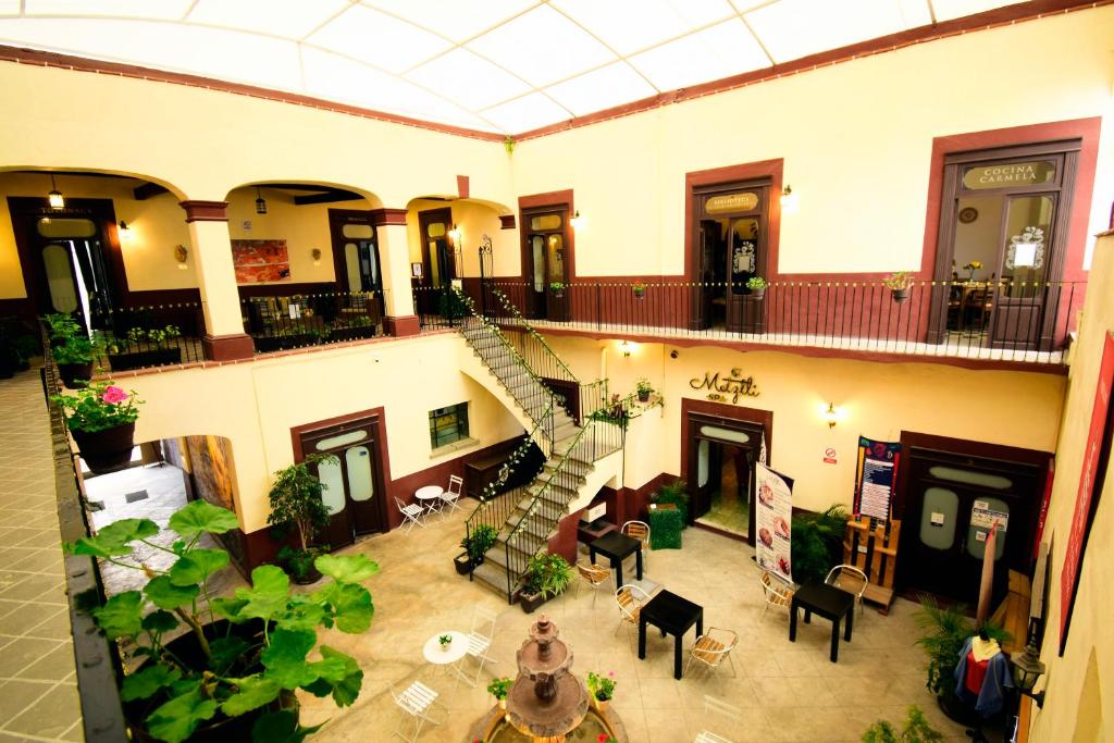 an overhead view of a building with a staircase at Quinta Alhóndiga Galindo Hotel Boutique in Cholula