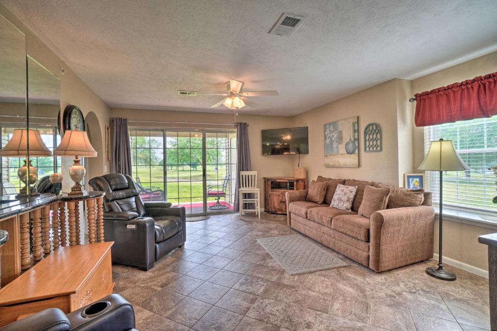 a living room with a couch and two chairs at Branson Resort Condo with Scenic Patio and Pool Access in Branson