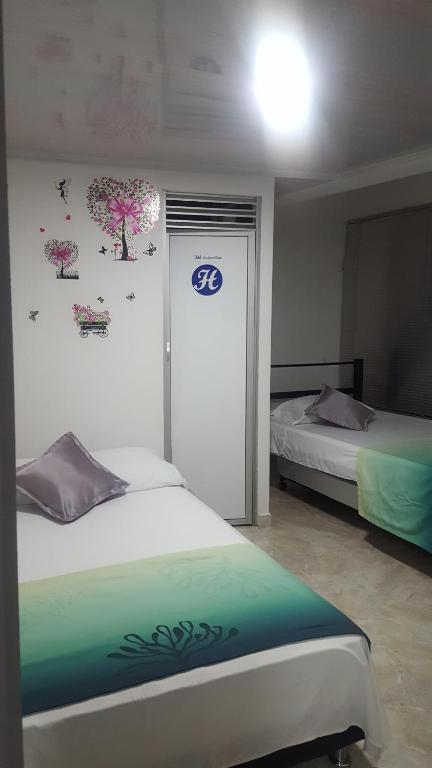 Postel nebo postele na pokoji v ubytování Hotel La Castellana