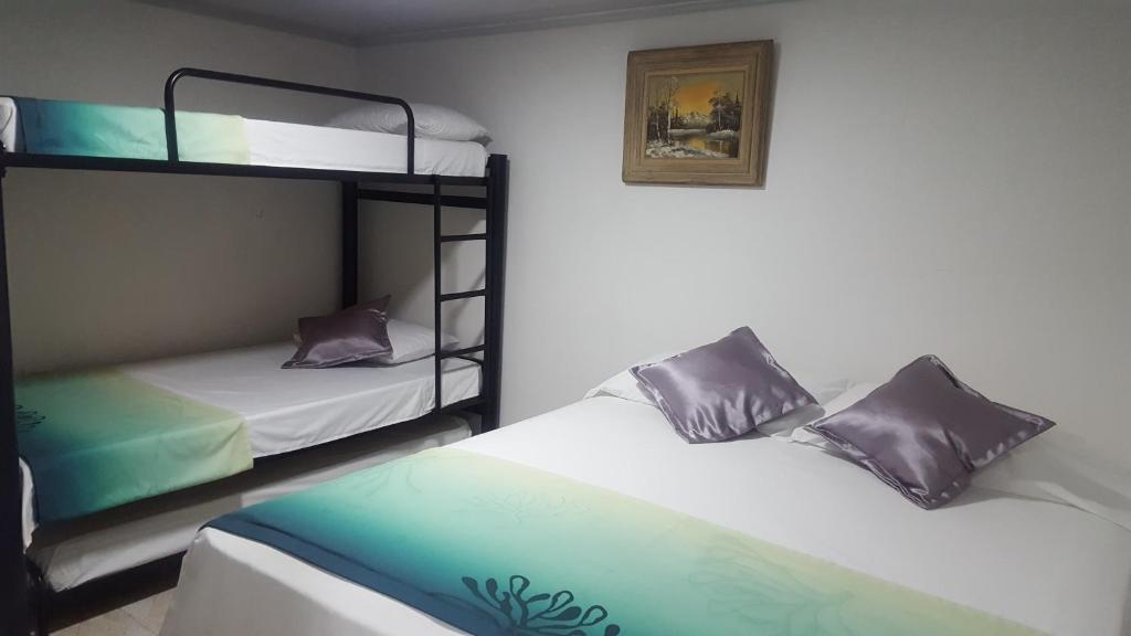 Postel nebo postele na pokoji v ubytování Hotel La Castellana
