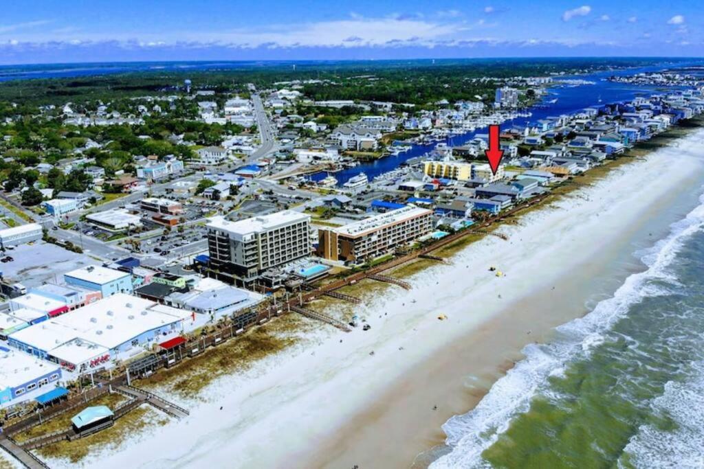 an aerial view of the beach and buildings at Beach Harbour 16 @ The Carolina Beach Boardwalk - Full Remodel! in Carolina Beach