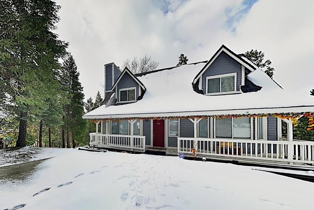 a house with snow on the roof at Tree-Top Getaway in Lake Arrowhead