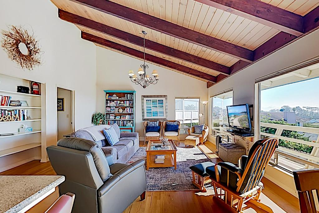 a living room with a couch and a tv at Hillcrest Haven in Morro Bay