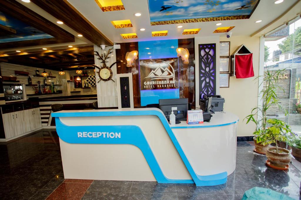 a reception area of a restaurant with a reception desk at Gauri Shankar Hotel Nagarkot in Nagarkot