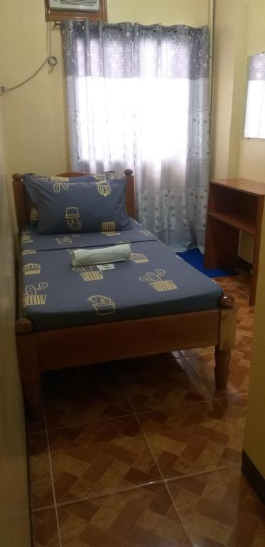 Postel nebo postele na pokoji v ubytování Divine Castle Travelers Inn